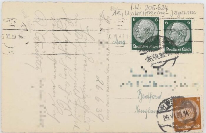 Vintage postcard with stamps and handwritten text. Features German stamps, dated postmark, and cursive writing. Antique postcard with classic stamps. Antique object, vintage art.